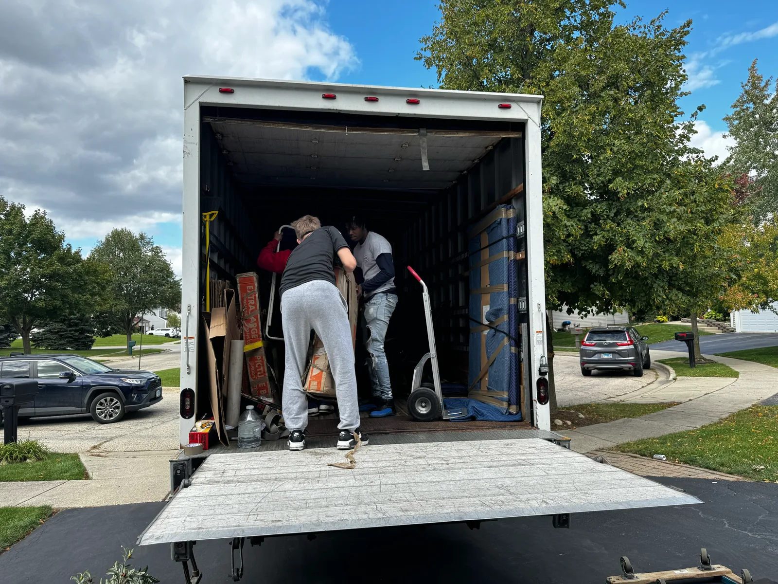Crew organizing a truck interior for an Arlington move